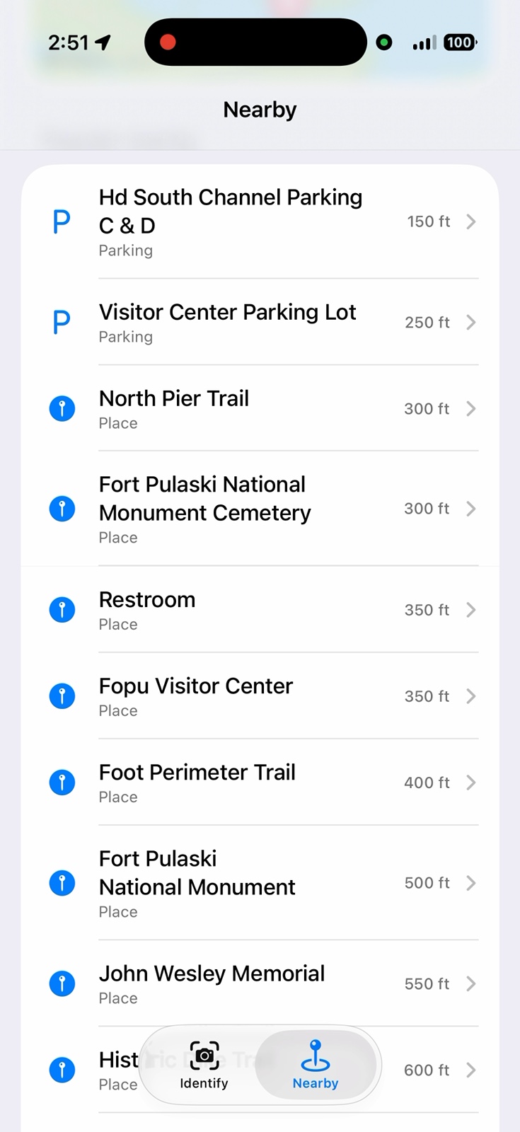 iPhone screenshot of Lookabout's Nearby tab at Fort Pulaski, listing parking lots, the North Pier Trail, the monument cemetery, and the Fopu Visitor Center 350 feet away.